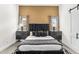 Main bedroom features a modern bed, gold accent wall and two large windows at 5036 N Scottsdale Rd, Paradise Valley, AZ 85253