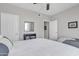 Bedroom with a bed, book case, and accent mirror with bright, natural light at 5401 E Van Buren St # 3113, Phoenix, AZ 85008