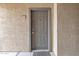 Neutral-colored front door and textured building exterior at 5401 E Van Buren St # 3113, Phoenix, AZ 85008