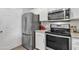 Close up on modern kitchen appliances including stainless steel refrigerator and microwave at 5401 E Van Buren St # 3113, Phoenix, AZ 85008