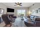 Comfortable living room featuring a fireplace and balcony with outdoor seating at 5401 E Van Buren St # 3113, Phoenix, AZ 85008