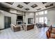 Bright lounge area with fireplace, large TV, comfortable seating and tables at 5401 E Van Buren St # 3113, Phoenix, AZ 85008