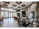 Spacious lounge area featuring comfortable seating, a fireplace, a dining table, and natural light at 5401 E Van Buren St # 3113, Phoenix, AZ 85008