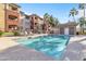 Inviting community pool with lounge chairs and clear blue water for relaxation at 5401 E Van Buren St # 3113, Phoenix, AZ 85008