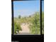 View of desert landscape through a window, highlighting the natural surroundings at 5401 E Van Buren St # 3113, Phoenix, AZ 85008