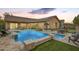 Spacious backyard featuring a pool, patio, and lush landscaping at 5528 W Mine Trl, Phoenix, AZ 85083