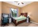 Inviting bedroom with a desk and window view, creating a cozy and functional space at 5528 W Mine Trl, Phoenix, AZ 85083