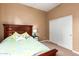 Well-lit bedroom featuring a comfortable bed and ample closet space, perfect for rest and storage at 5528 W Mine Trl, Phoenix, AZ 85083