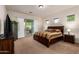 Cozy main bedroom with a sliding glass door to the patio and a view of the backyard at 5528 W Mine Trl, Phoenix, AZ 85083