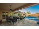 Inviting outdoor living space with a pool, dining area, and desert landscape views at 5528 W Mine Trl, Phoenix, AZ 85083