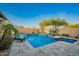 Stunning pool with spa and sun loungers in a beautifully landscaped backyard at 5528 W Mine Trl, Phoenix, AZ 85083