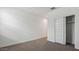 Bedroom with closet, carpet, and neutral paint at 5693 E Axle Ln, San Tan Valley, AZ 85140