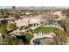 Aerial view of a home with a pool, landscaped backyard, and mountain views at 7635 E Sweetwater Ave, Scottsdale, AZ 85260