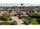 A high angle view of a beautiful single-Gathering home with manicured landscaping at 7635 E Sweetwater Ave, Scottsdale, AZ 85260