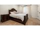 Bedroom featuring an ornate, wood-framed bed set and natural light from the window at 7635 E Sweetwater Ave, Scottsdale, AZ 85260