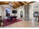 Spacious game room with high ceilings, a statement stone pillar, and a stylish pool table at 7635 E Sweetwater Ave, Scottsdale, AZ 85260