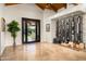 Open living area features a built-in wine rack, tile flooring, and access to the patio at 7635 E Sweetwater Ave, Scottsdale, AZ 85260