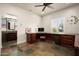Home office with custom built-in cabinets and an ensuite bathroom at 7635 E Sweetwater Ave, Scottsdale, AZ 85260