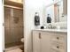 Beautiful bathroom with modern vanity, stylish mirror, and glass-enclosed shower at 8055 E Thomas Rd # G101, Scottsdale, AZ 85251