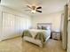 Comfortable bedroom with neutral tones, ceiling fan, and ample closet space at 8055 E Thomas Rd # G101, Scottsdale, AZ 85251