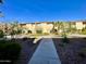 Well-maintained courtyard with lush greenery and a walkway leading to apartments, creating a welcoming environment at 8055 E Thomas Rd # G101, Scottsdale, AZ 85251
