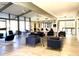 Spacious lounge area with modern furniture, large windows, and a relaxed atmosphere at 8055 E Thomas Rd # G101, Scottsdale, AZ 85251
