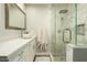 Modern bathroom with a walk-in shower, white vanity, vessel sink and marble tile surround at 8115 E Cypress St, Scottsdale, AZ 85257