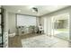 Versatile bonus room with projector, screen, sliding glass doors to backyard, and neutral decor at 8115 E Cypress St, Scottsdale, AZ 85257