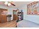 Bedroom featuring a door, bookshelf and TV; a comfortable space for relaxing and rest at 876 W El Monte Pl # 3, Chandler, AZ 85225