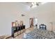 Bright bedroom with high ceilings, a ceiling fan, and a modern black and white comforter at 876 W El Monte Pl # 3, Chandler, AZ 85225