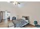 Bright bedroom featuring tile floors, cozy bed, natural light, and a ensuite bathroom at 876 W El Monte Pl # 3, Chandler, AZ 85225