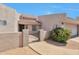 Inviting gated front entrance with desert landscaping leading to the front door and attached garage at 876 W El Monte Pl # 3, Chandler, AZ 85225