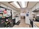 Bright kitchen with white cabinets, modern appliances, and view of the dining and living areas at 876 W El Monte Pl # 3, Chandler, AZ 85225