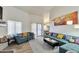 Comfortable living room featuring tile floors, plenty of natural light, and stylish decor at 876 W El Monte Pl # 3, Chandler, AZ 85225
