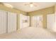 Open floor plan bedroom with built-in storage, closet, and direct access to patio at 8785 E Sandtrap Ct, Gold Canyon, AZ 85118