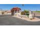 Fairway Views at Gold Canyon Ranch entrance with stucco wall and blooming flowers at 8785 E Sandtrap Ct, Gold Canyon, AZ 85118