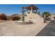Fairway Views entry features a decorative fountain, gate, and covered area at 8785 E Sandtrap Ct, Gold Canyon, AZ 85118