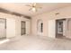 Comfortable main bedroom with carpet and a ceiling fan, offering ample closet space at 8785 E Sandtrap Ct, Gold Canyon, AZ 85118
