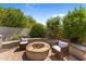 Charming backyard fire pit area with comfortable seating, perfect for relaxing evenings outdoors at 9285 E Canyon Vw, Scottsdale, AZ 85255