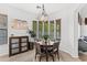 Cozy dining area features tile flooring, a round table, and a chandelier at 9285 E Canyon Vw, Scottsdale, AZ 85255