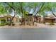 Inviting home exterior showcases neutral colors, stone accents, desert landscaping, and a porte cochere at 9285 E Canyon Vw, Scottsdale, AZ 85255
