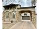 Beautiful two-story home featuring a neutral color scheme and stone accents on the facade and porte-cochere at 9285 E Canyon Vw, Scottsdale, AZ 85255