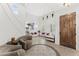 Bright foyer featuring soaring ceilings, staircase, tile floors with inlay, and formal seating at 9285 E Canyon Vw, Scottsdale, AZ 85255