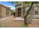 Charming front exterior with stone accents, gravel landscaping, and inviting front door at 9285 E Canyon Vw, Scottsdale, AZ 85255