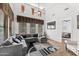Bright living room featuring high ceilings, ample windows, and a stylish sectional sofa at 9285 E Canyon Vw, Scottsdale, AZ 85255