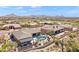 Stunning aerial view of a Southwestern home with a pool, spa, desert landscaping, and mountain views at 9620 E Roadrunner Dr, Scottsdale, AZ 85262