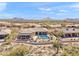 An aerial view of a home with a backyard pool in a desert community at 9620 E Roadrunner Dr, Scottsdale, AZ 85262