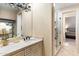 Bathroom with a vanity and a shower with glass door, offering a luxurious and modern design at 9620 E Roadrunner Dr, Scottsdale, AZ 85262