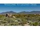 Welcome to Legend Trail community sign with desert landscape and mountains in the background on a clear day at 9620 E Roadrunner Dr, Scottsdale, AZ 85262