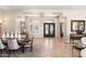 Spacious foyer with tile flooring, decorative mirrors, and iron double doors welcoming guests at 9620 E Roadrunner Dr, Scottsdale, AZ 85262
